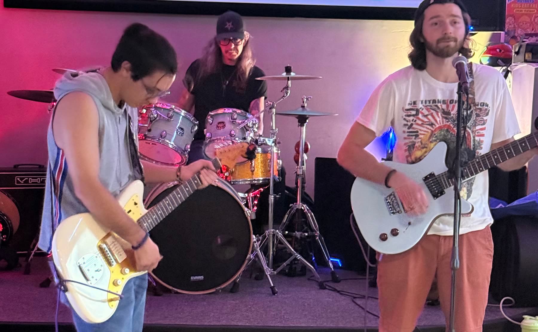 The Club on stage — guitar, drums and vocals