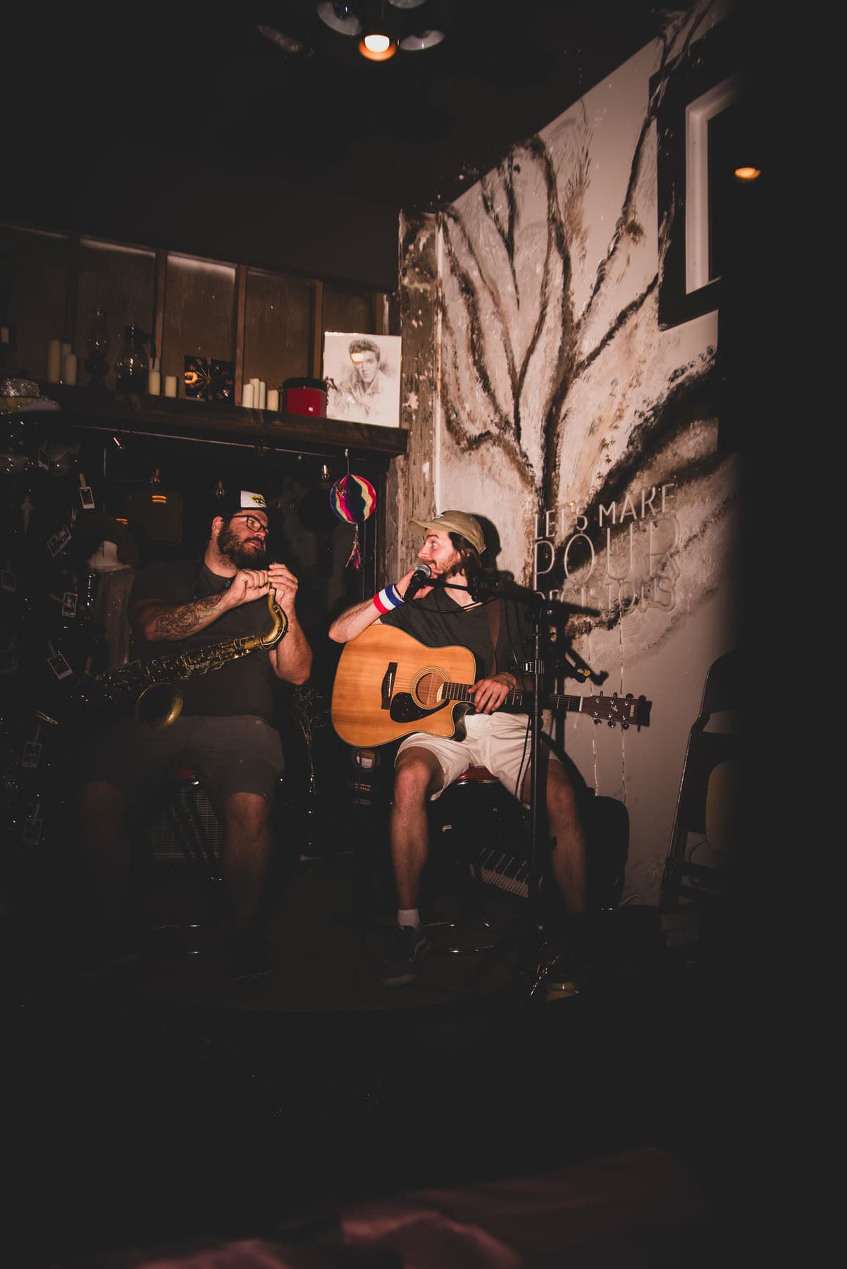 Lee and the Sax Wizard playing seated in a dark room